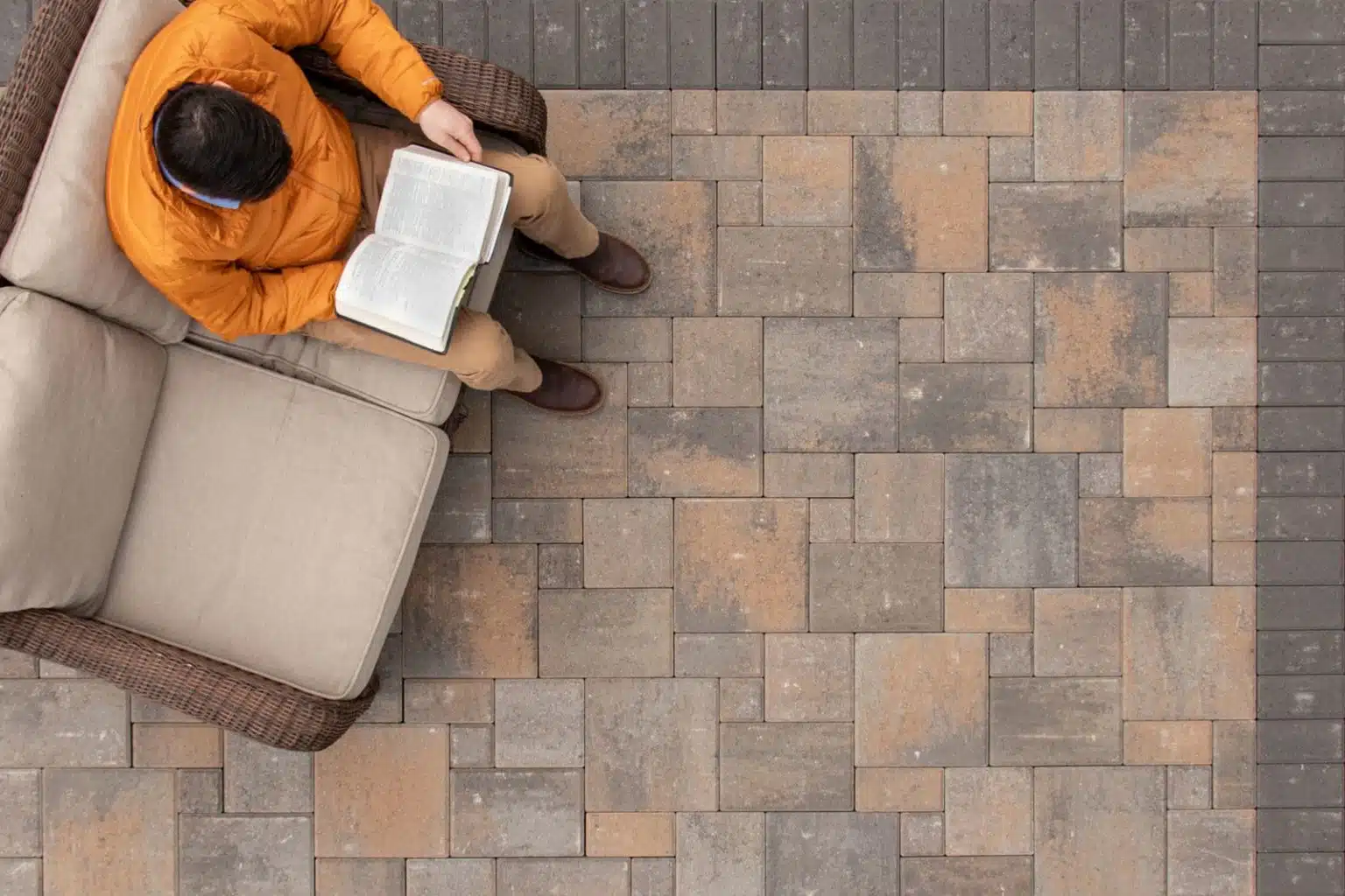 Leiden Stone Collection Concrete Pavers Jamestown Blend Patio Person Sitting Studying